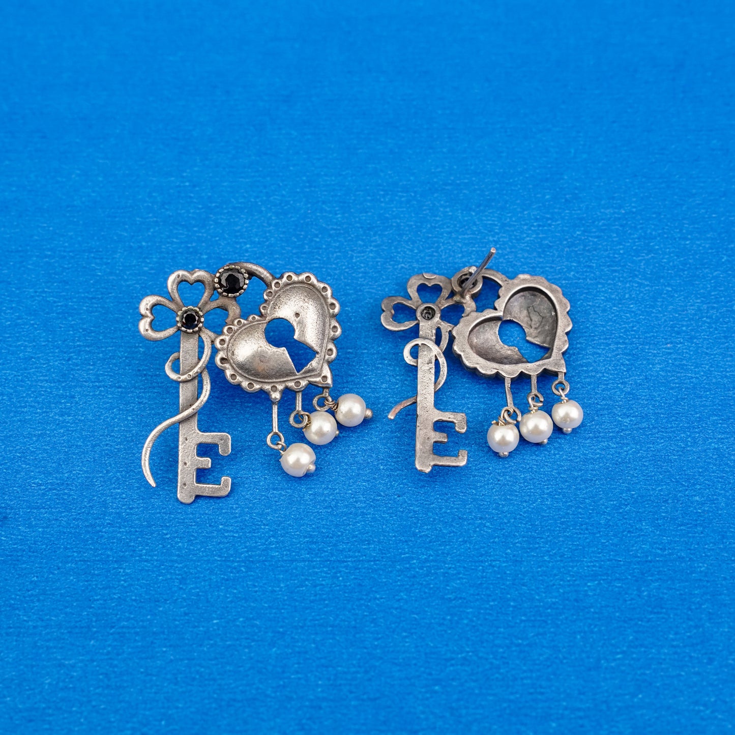 Kunjika- Silver Brass Oxidised dangler earrings(Black)