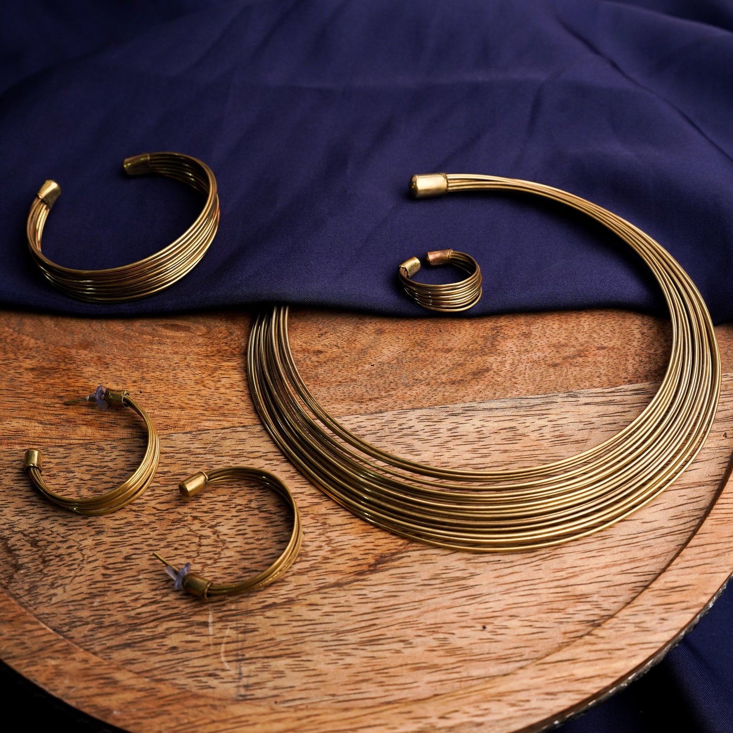 Chitrangada- Multistrand Brass polished Hasli with Earrings & Adjustable Ring