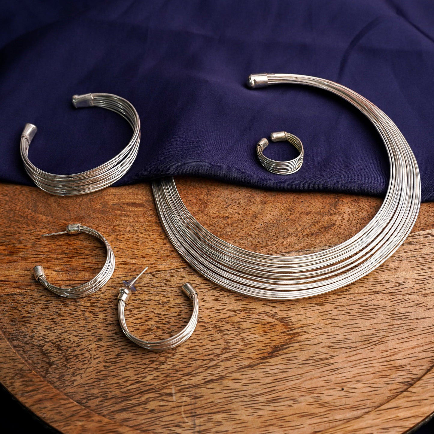 Hemaprabha- Multistrand Brass polished Hasli with Earrings & Adjustable Ring