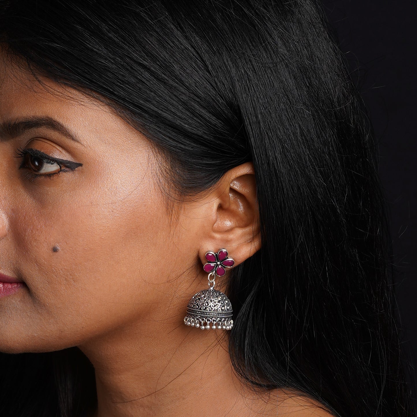 Champika- Silver Brass Stone-Studded Jhumka Earrings(Green)