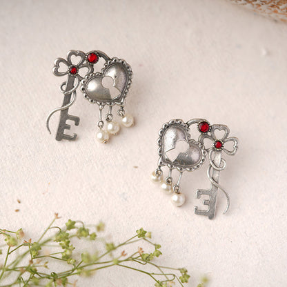 Kunjika- Silver Brass Oxidised dangler earrings(Red)