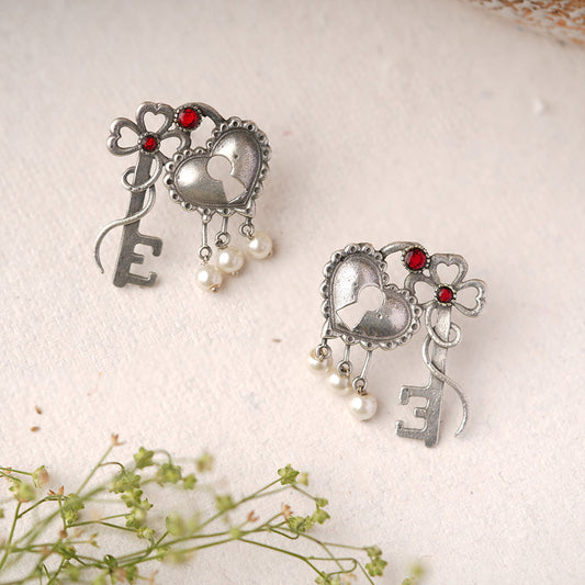 Kunjika- Silver Brass Oxidised dangler earrings(Red)