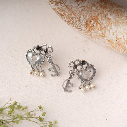 Kunjika- Silver Brass Oxidised dangler earrings(Black)