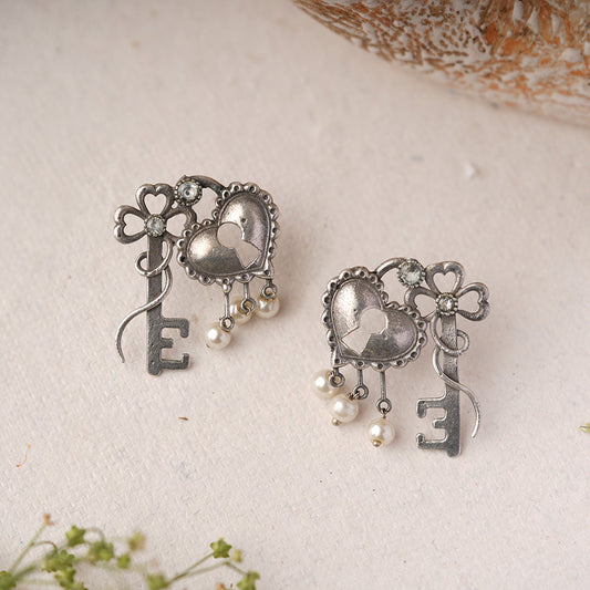 Kunjika- Silver Brass Oxidised dangler earrings (White)