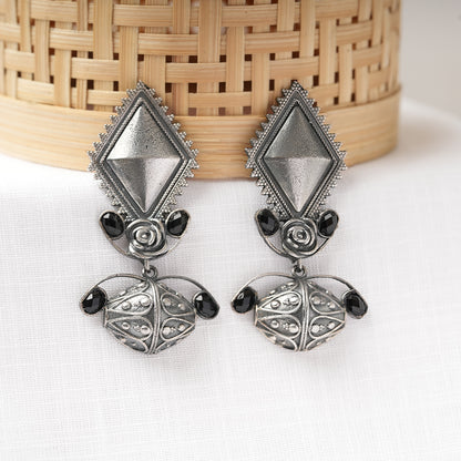 Suvarna- Silver Brass Oxidised dangler earrings