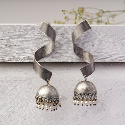 Meghika- Silver Toned Brass Jhumka Earrings
