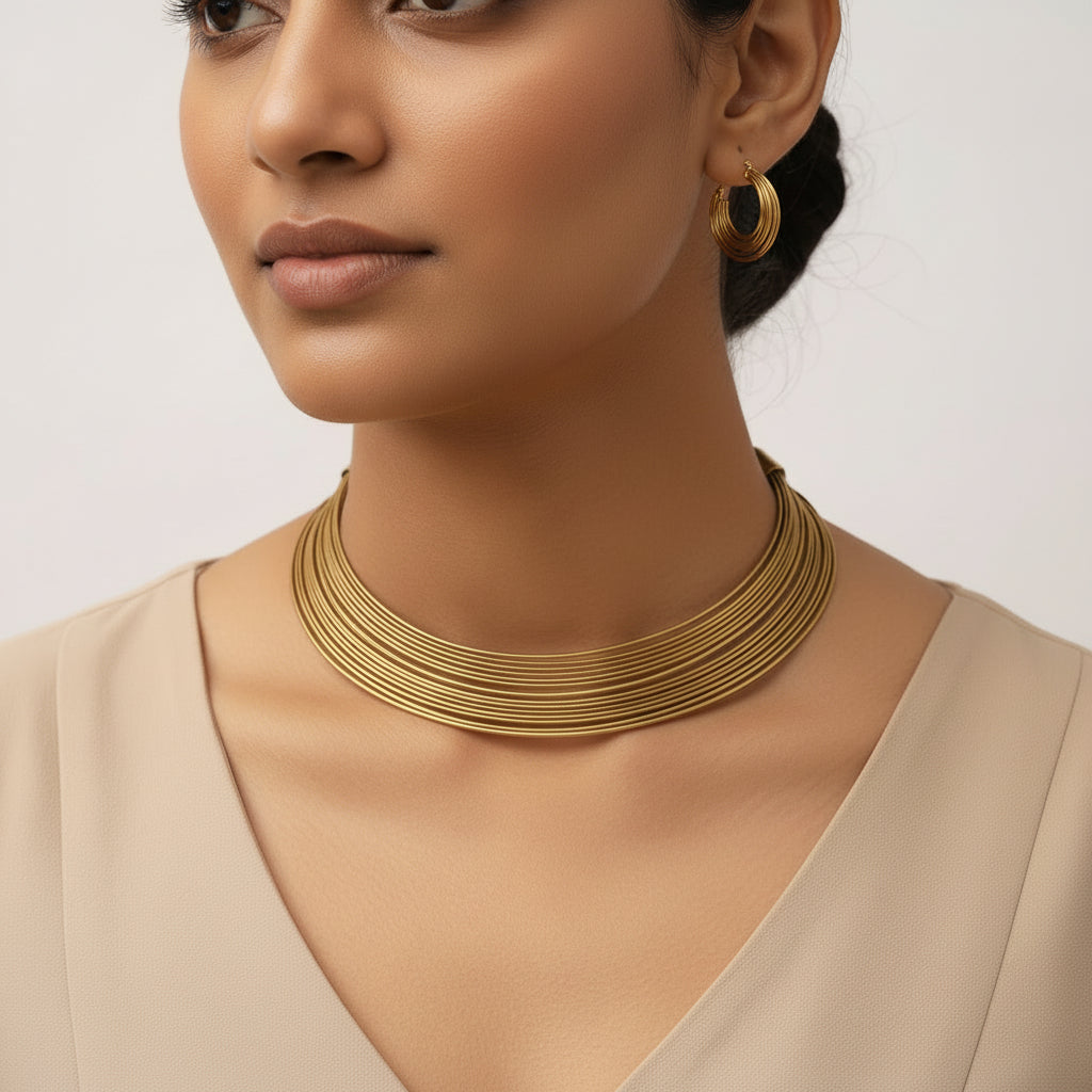 Chitrangada- Multistrand Brass polished Hasli with Earrings & Adjustable Ring