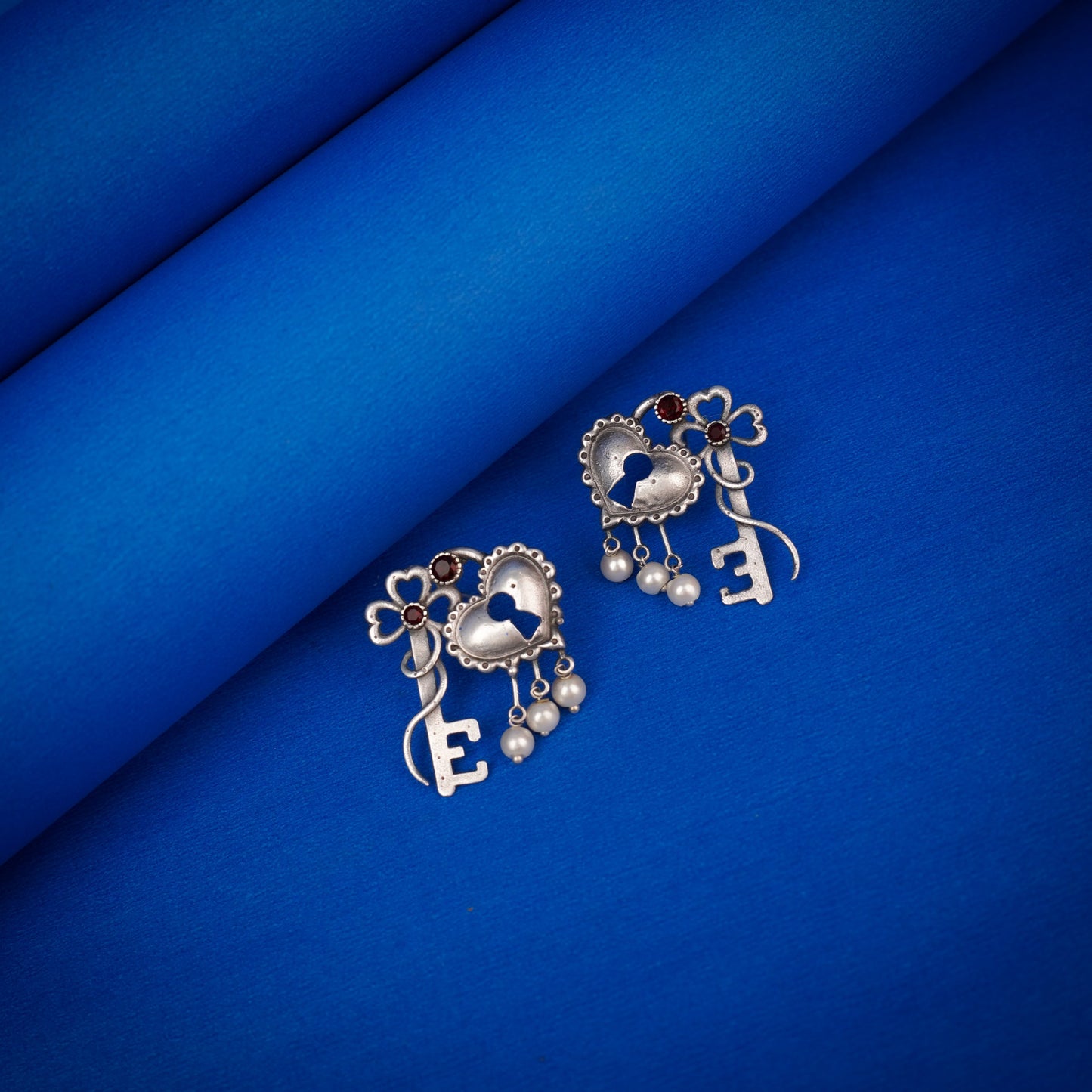 Kunjika- Silver Brass Oxidised dangler earrings(Red)