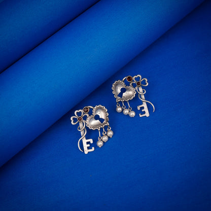 Kunjika- Silver Brass Oxidised dangler earrings(Red)