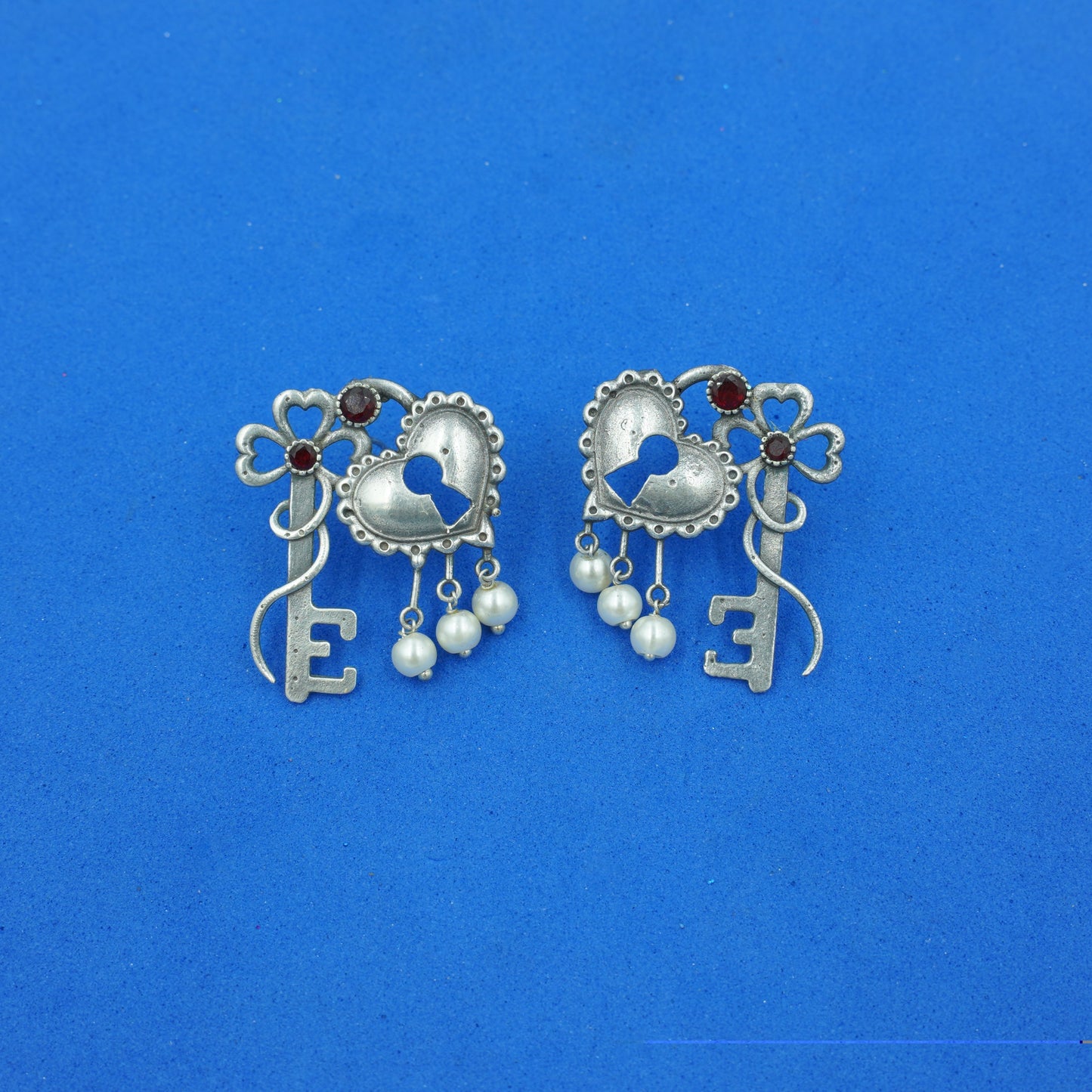 Kunjika- Silver Brass Oxidised dangler earrings(Red)