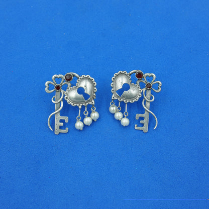 Kunjika- Silver Brass Oxidised dangler earrings(Red)