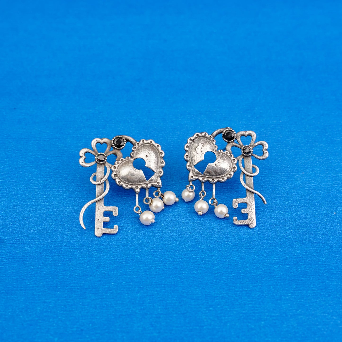 Kunjika- Silver Brass Oxidised dangler earrings(Black)