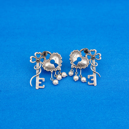 Kunjika- Silver Brass Oxidised dangler earrings(Black)