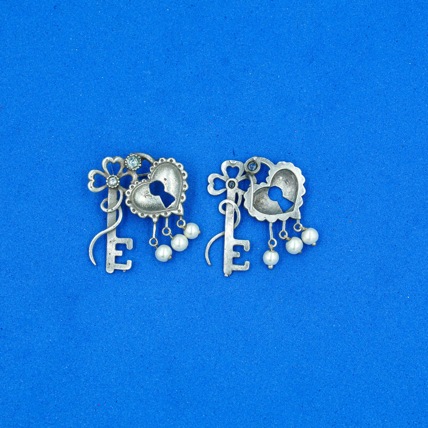 Kunjika- Silver Brass Oxidised dangler earrings (White)