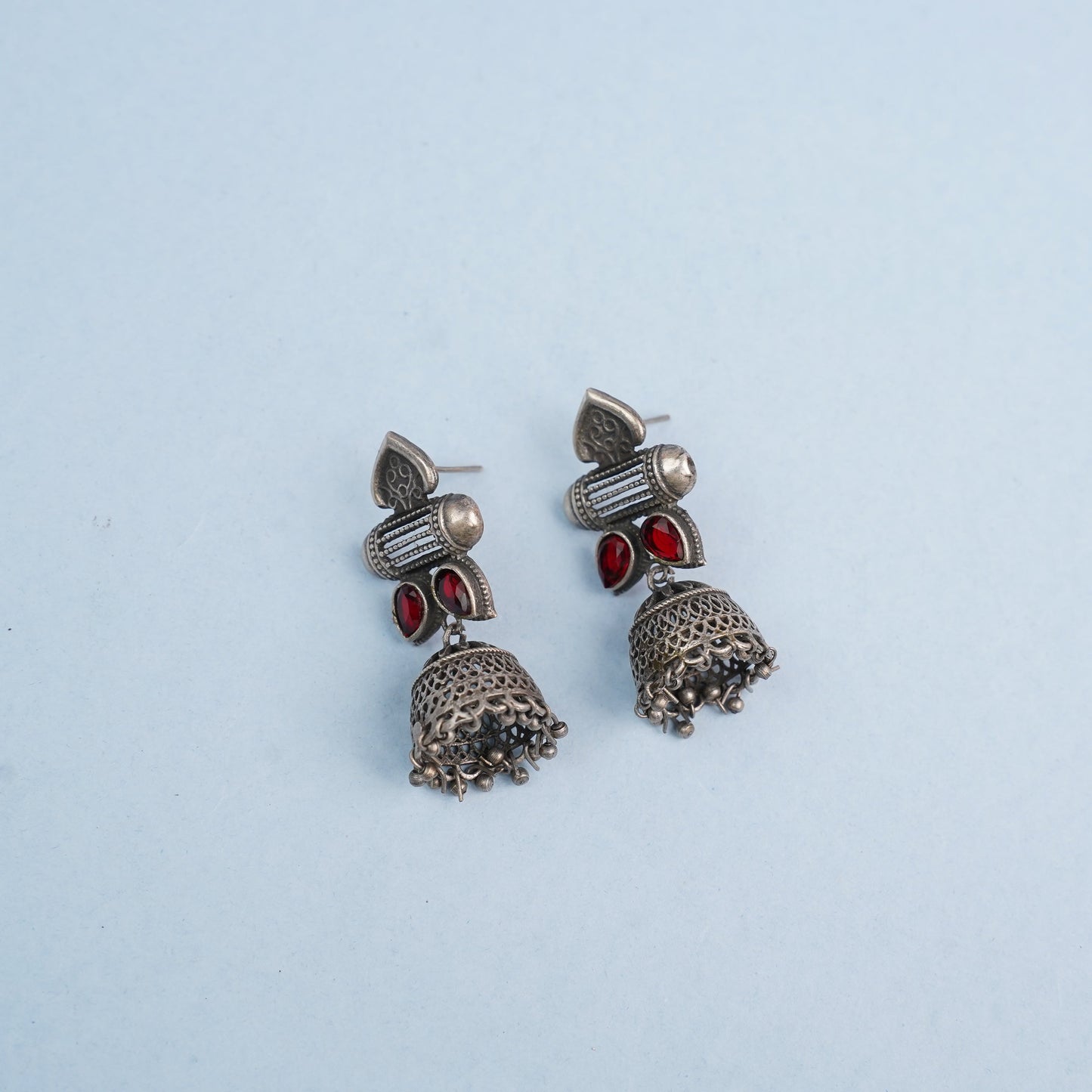Taal- Silver Brass Oxidised jhumka earrings(Red)